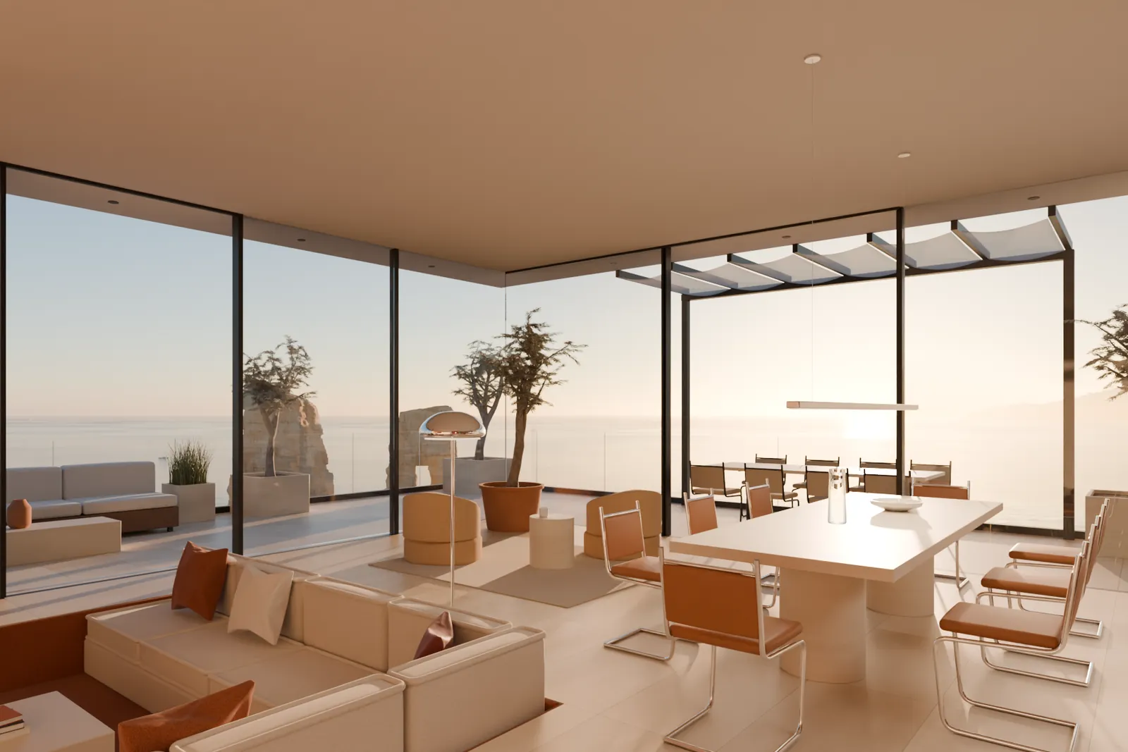 Living room of Penthouse 9 at sunset: sunken sofa pit, dining table and floor-to-ceiling glass facing the sea